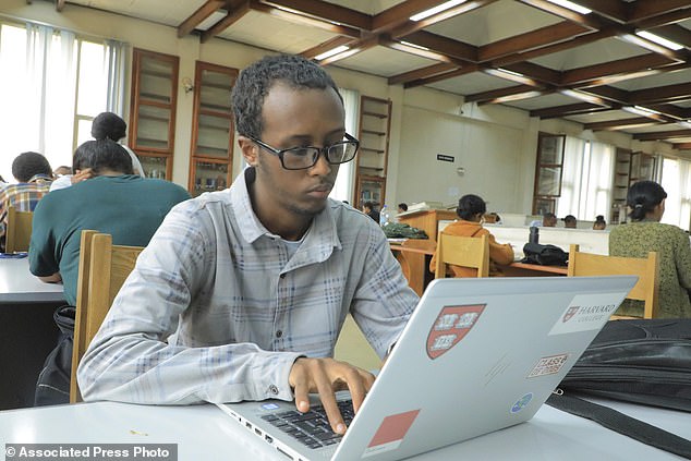 Yonas Nuguse, 21 years old, destined for Harvard University working on a computer at Wemezeker National Library in Addis Ababa, Ethiopia Friday