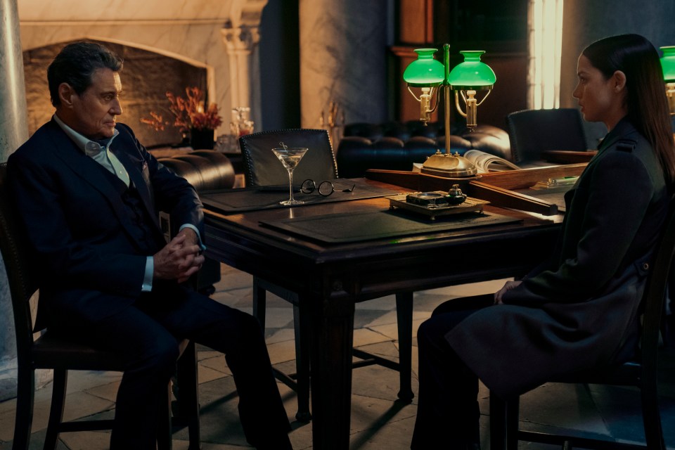 Film still of Ian McShane as Winston and Ana de Armas as Eve in a scene from Ballerina.