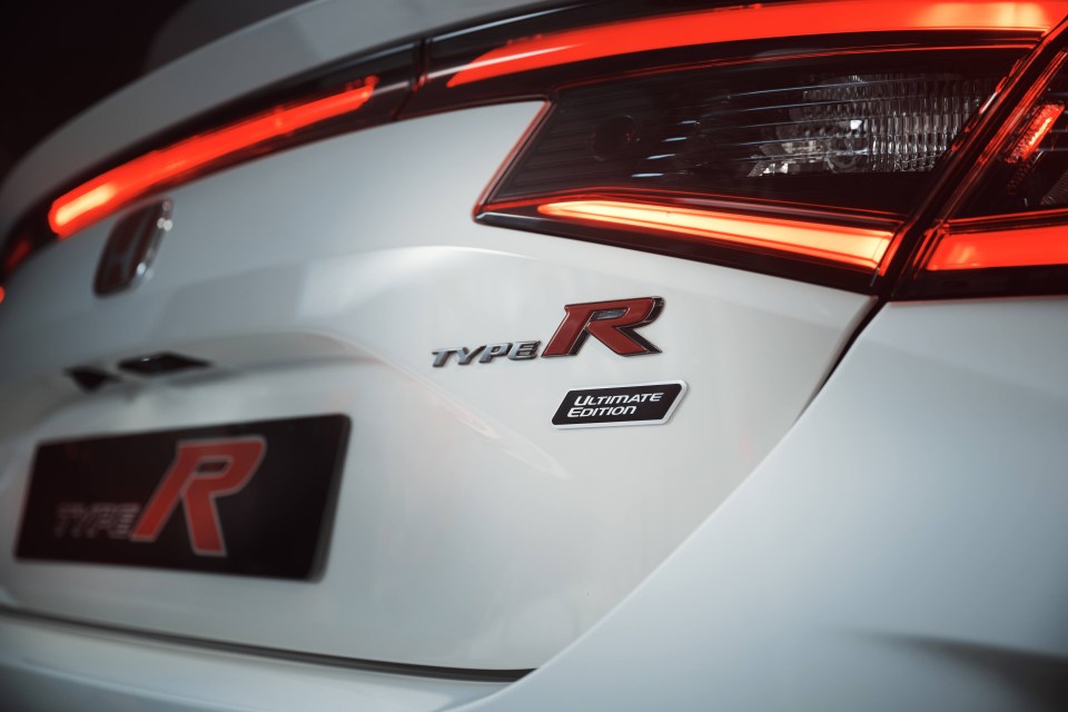 Close-up of a white Honda Civic Type R Ultimate Edition's rear, showing the taillights and badging.
