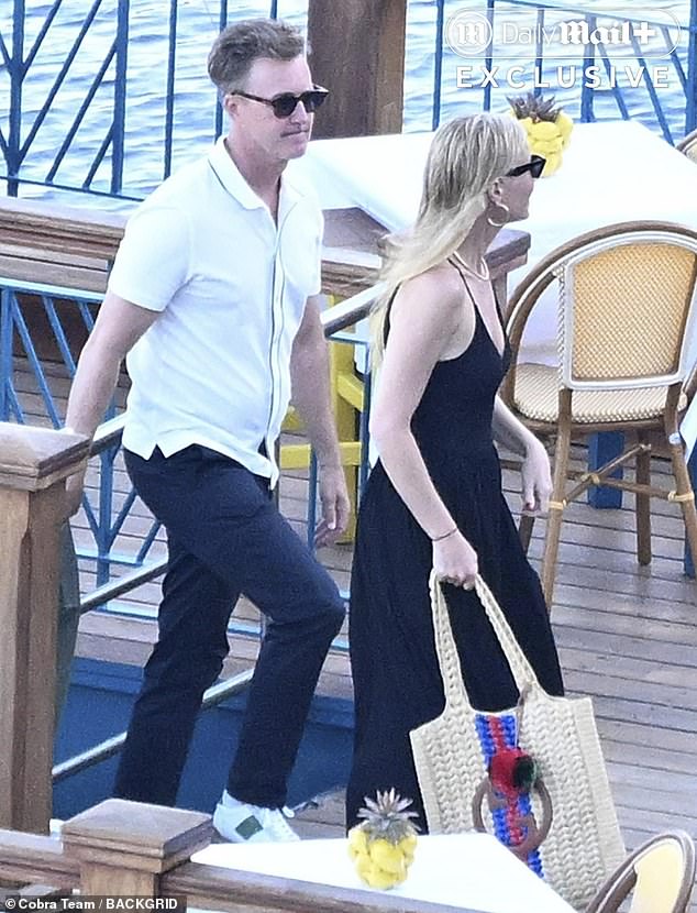 Later, a radiant Paltrow slipped into a chic, black maxi dress as the group, which included actor Edward Norton (left) headed to shore for dinner