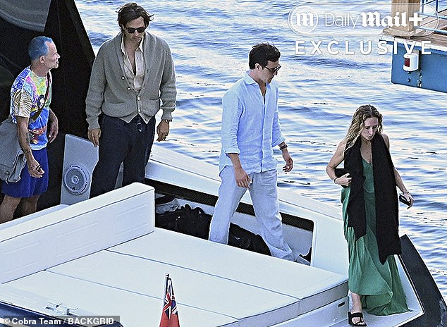 Paltrow debuted her 'IDGAF' figure on the yacht vacation with surprising 90s legends including Flea from the Red Hot Chilli Peppers (left), husband Brad Falchuk (second left) and other friends