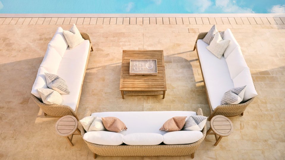 Overhead view of a patio furniture set by a pool.