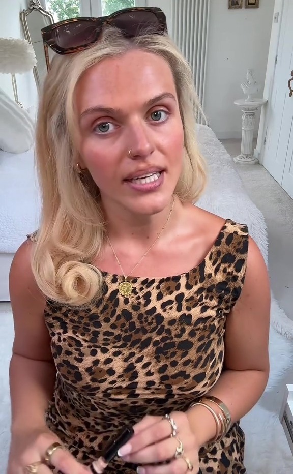 Woman in leopard print dress discussing diet and weight loss.