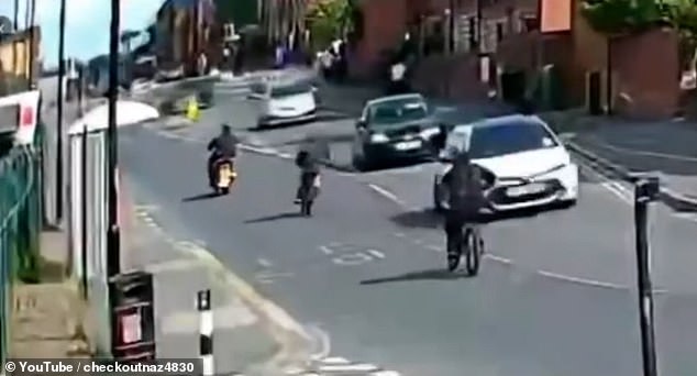 Video shared online appears to show two e-bike riders and a motorcyclist driving in one direction