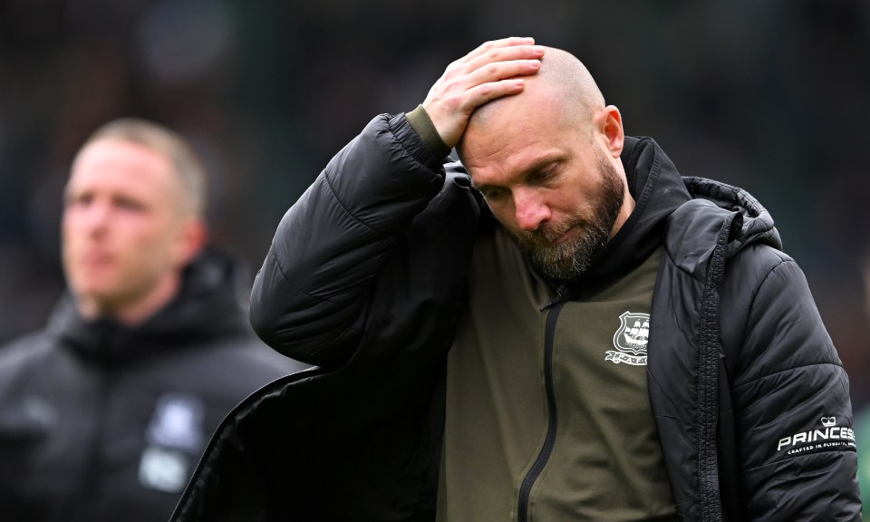 Ian Foster, manager of Plymouth Argyle, looking dejected.