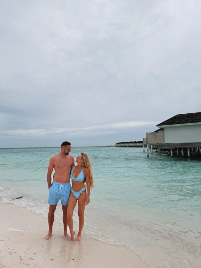 Laura Anderson is slammed for flaunting her 'free holidays' as she returns home from first holiday with Clark Robertson
