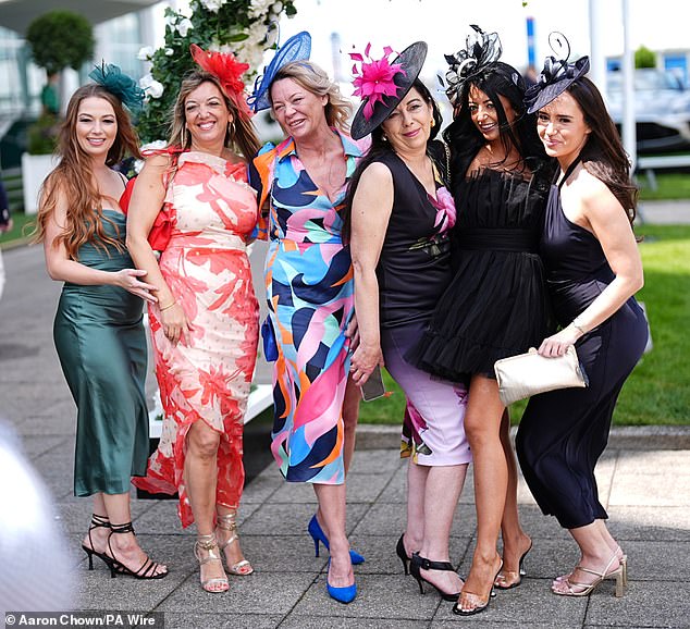 Racegoers during Ladies Day of the Betfred Derby Festival at Epsom Downs Racecourse