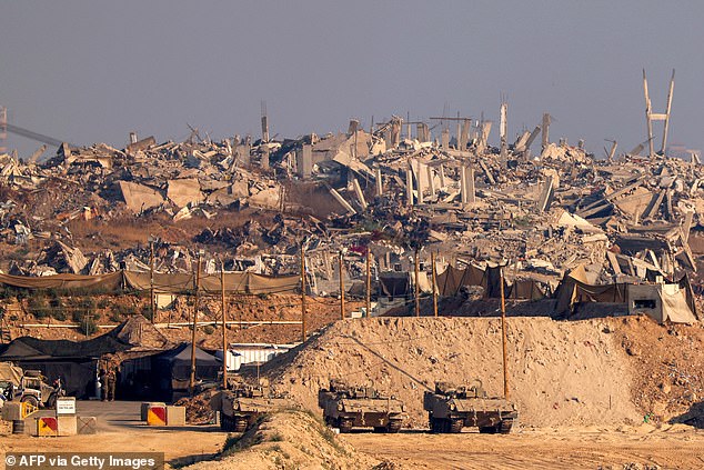 Israel has re-intensified an offensive against Gaza's dominant Hamas militant group since breaking a two-month-old ceasefire in March in a war triggered by Hamas' cross-border attack on October 7, 2023. Pictured: Israeli soldiers stay at a position near destroyed buildings in the besieged Palestinian territory on June 5, 2025