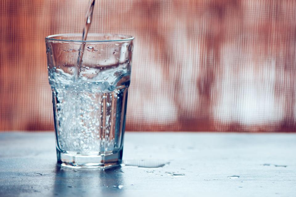 Water being poured into a glass.