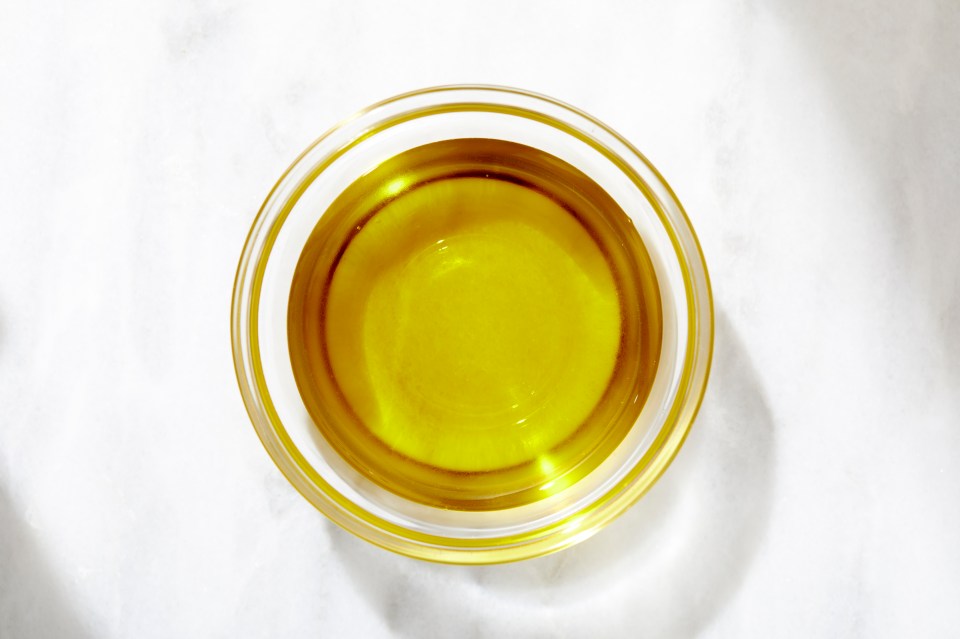 Overhead view of a bowl of olive oil.