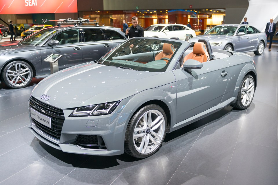 Gray Audi TT Roadster on display.