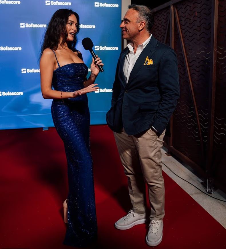 Kate Abdo interviewing a man at an event.