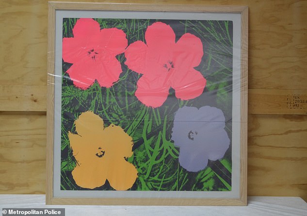 Officers raided two of Ahmad's warehouses in Britain and seized £1million of art - none of which were linked to the Ojiri case. Pictured is a work by Andy Warhol