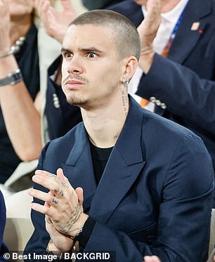 Romeo, 22, who The Mail revealed on Wednesday had split from girlfriend Kim Turnbull after seven months, couldn't contain his excitement as he watched the match