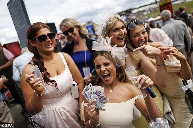 It's a good bet: Derby revellers celebrate and enjoy showing off their winnings