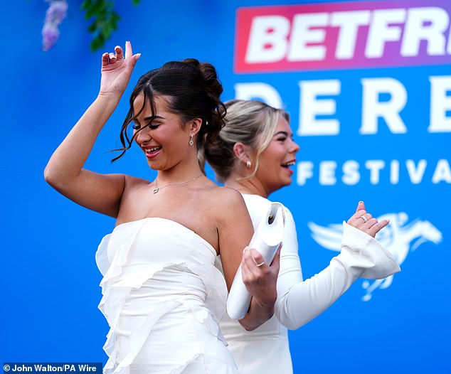 Racegoers at Epsom Downs Racecourse, on Ladies Day