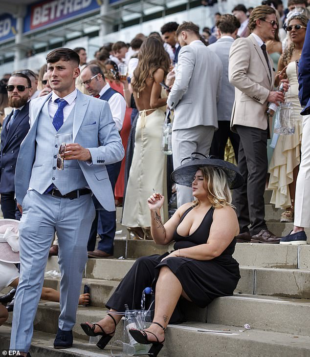 One lady rested her wearied feet by sitting on the steps in between the races on Friday