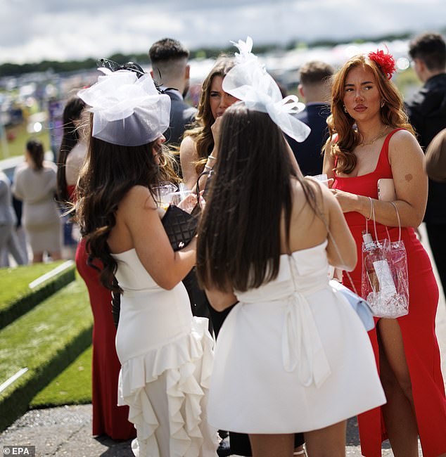Plenty of bottle: One racegoer carried her wine in a bag during this afternoon's races