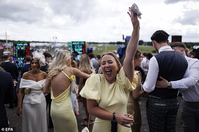Money moment: A woman yelps in delight after winning her bet