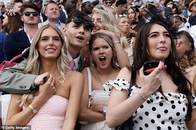 Racegoers show the anticipation on their faces as the race gets underway