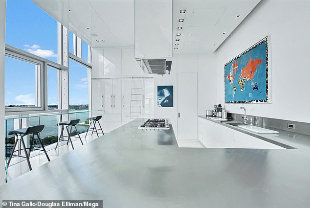 There are multiple kitchens in the penthouse and 360-degree views of the River Hudson and the stunning skyline