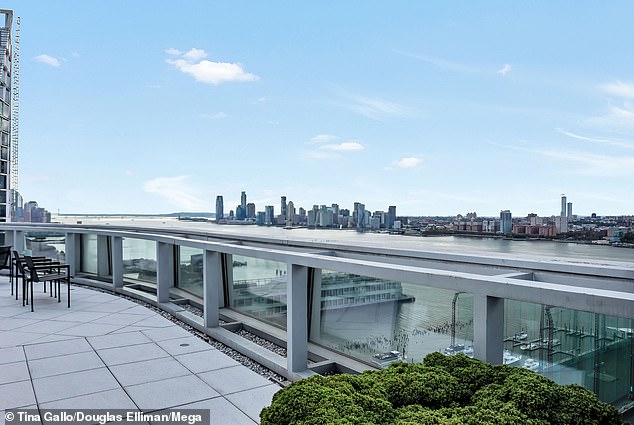 The penthouse features a private elevator entrance, a stunning views of the Hudson River and the Manhattan skyline