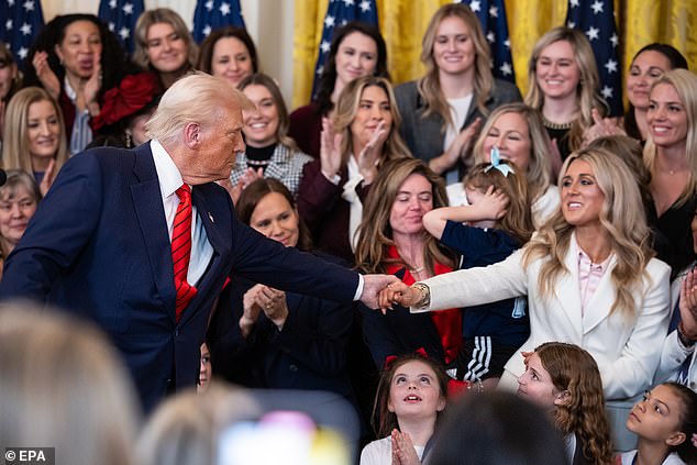 Gaines shakes Donald Trump's hand on the day he signed an executive order on trans athletes