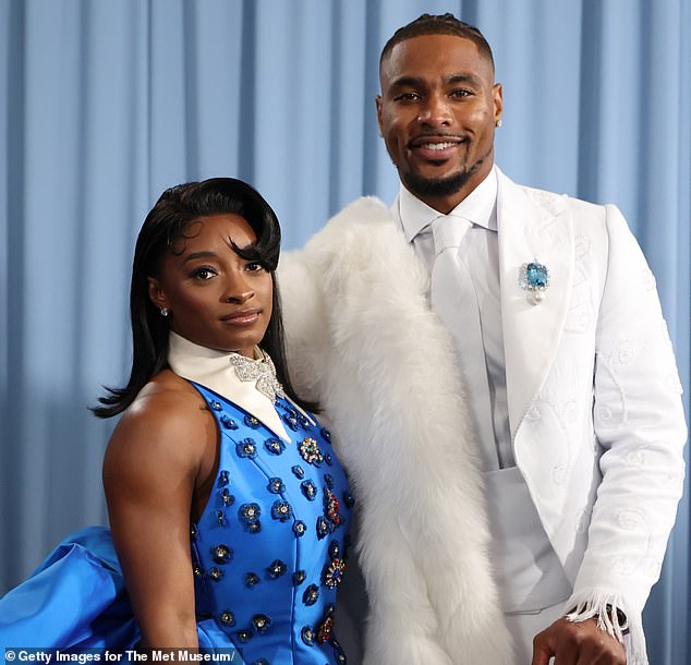 Biles pictured with her husband Jonathan Owens, who plays in the NFL for Chicago Bears