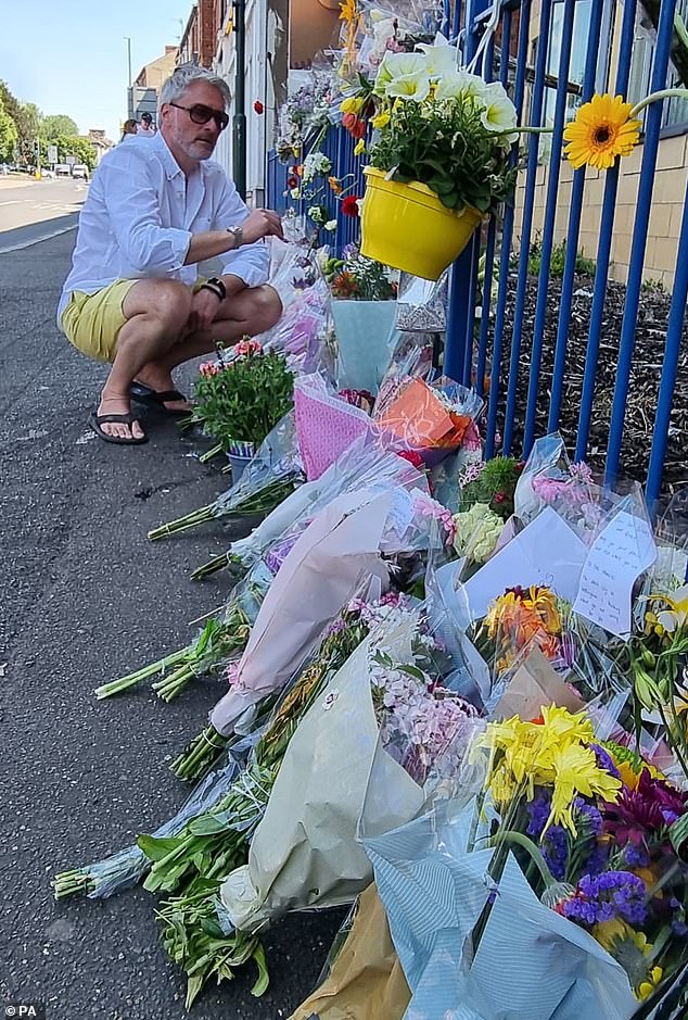 Pictured: Flowers laid by the family and friends of Barnaby Webber, including his father David Webber, at the scene on Ilkeston Road in Nottingham shortly after the murders