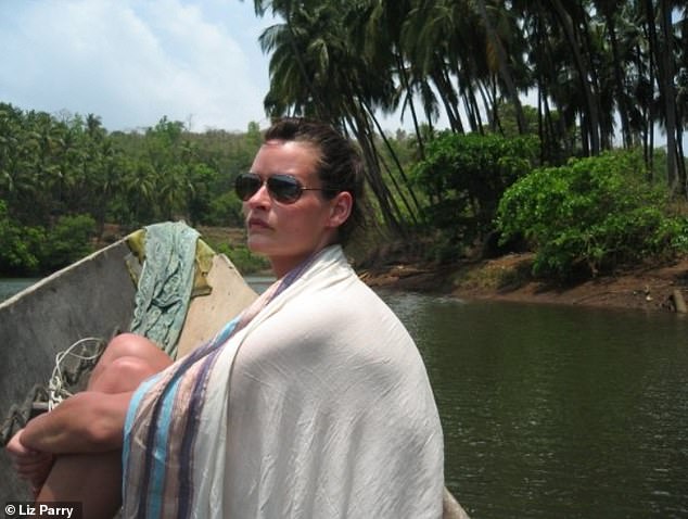 Liz started holidaying solo at aged 30. She's seen above on a boat in Goa in India