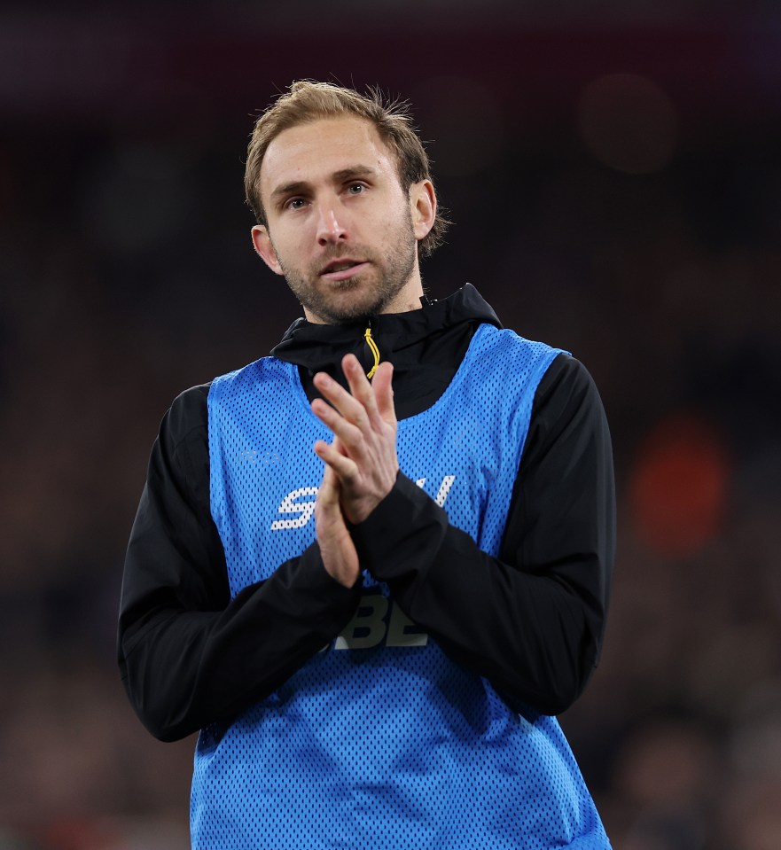 Craig Dawson of Wolverhampton Wanderers clapping during a Premier League match.