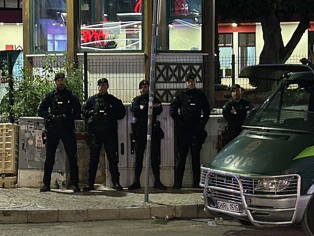 Police keep a watchful eye on the party strip in Albufeira in Portgual