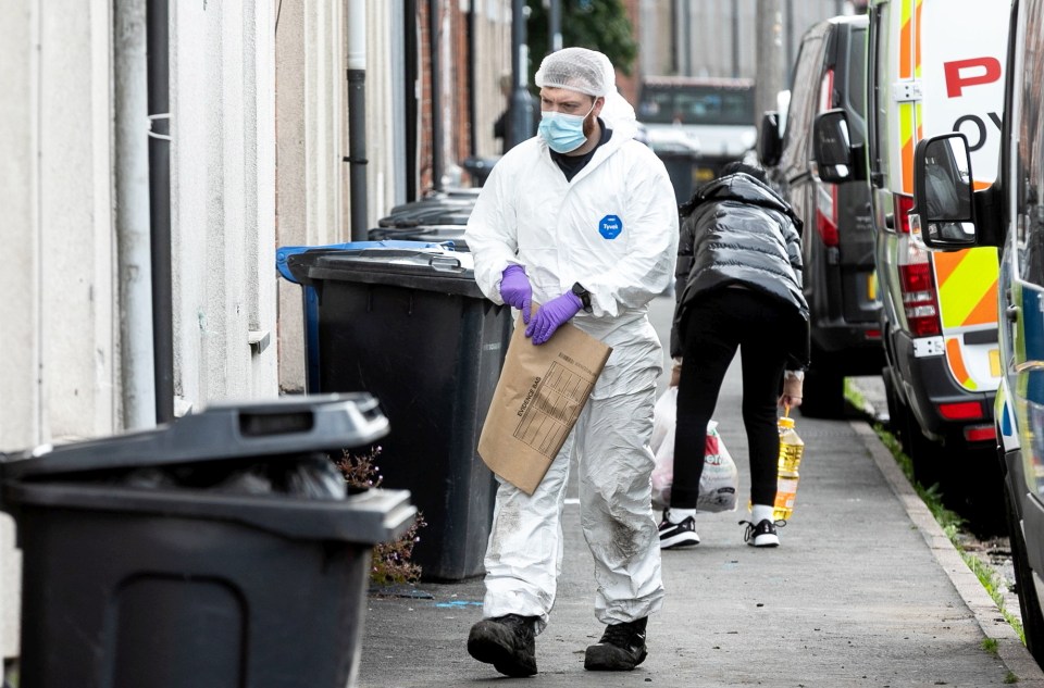 Forensics officer collecting evidence at a murder investigation scene.
