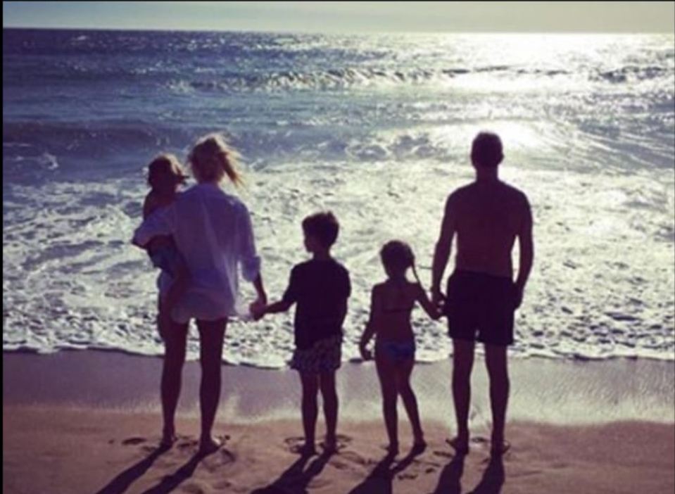 Holly Willoughby with her husband and three children at the beach.