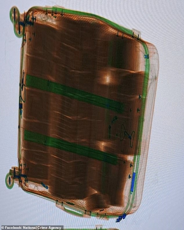 officers searched his three suitcases and two of them contained the cash