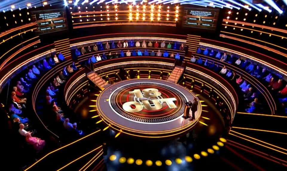 The 18 Out game show set with contestants.
