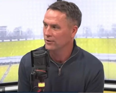 Man speaking into a microphone.