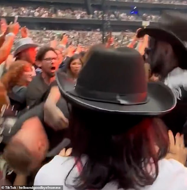 Other concert goers attempted to intervene during the brawl at the Tottenham Hotspur Stadium - it is unclear if security got involved