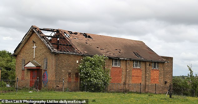 A seemingly abandoned church with part of its roof destroyed