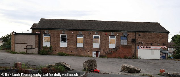 A building which appears to have been left abandoned projects the idea that the estate has been left to rot