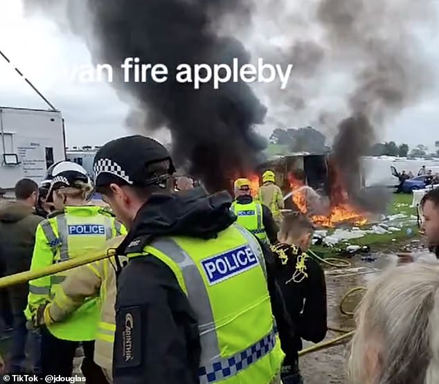 Some stall holders rushed to the scene and began dismantling a nearby white tent as firefighters worked to tackle the blaze