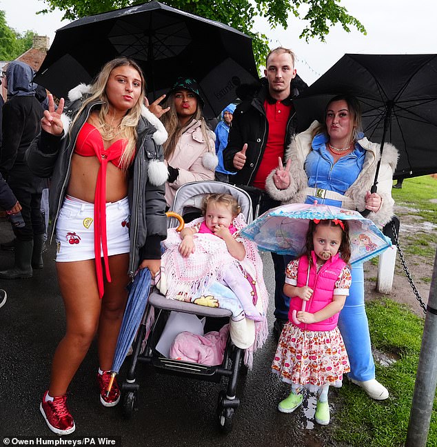 Visitors could be seen dressed in their finery and wrapped up in waterproof coats and donning wellies