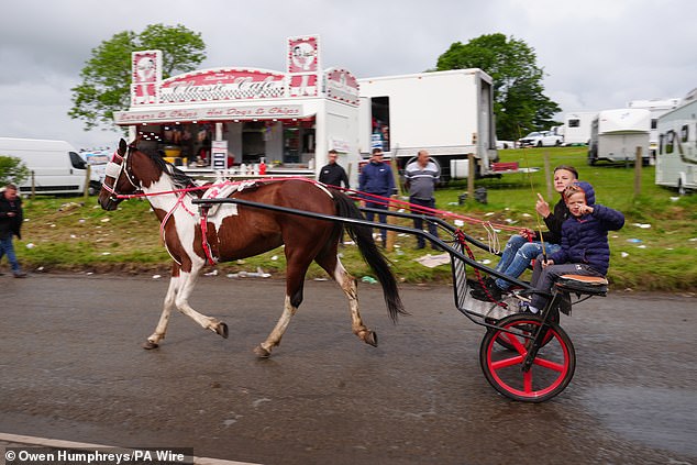 Even children hopped on their pony and traps to race around the historic fair in the rain