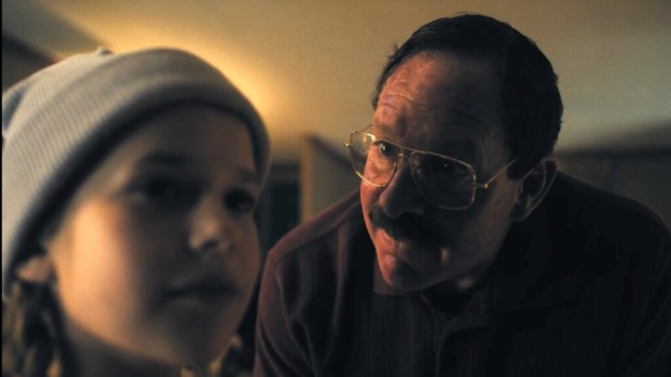 Close-up of a man and a young girl.