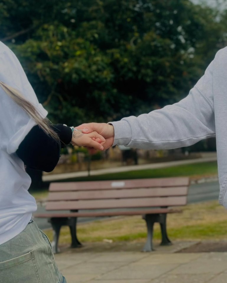 Two people holding hands.