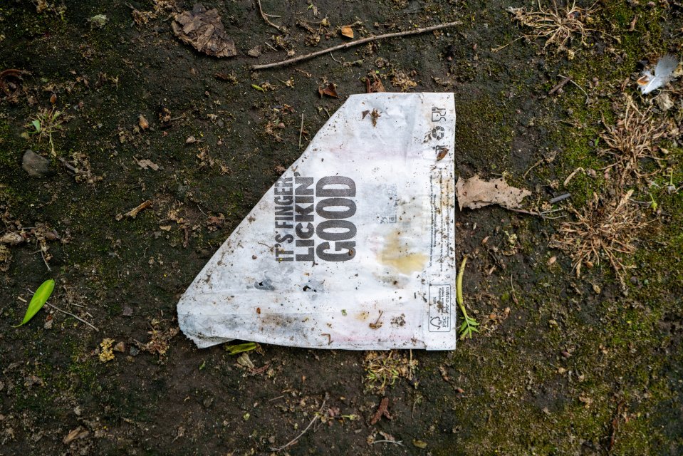 Litter from a KFC restaurant on the ground.