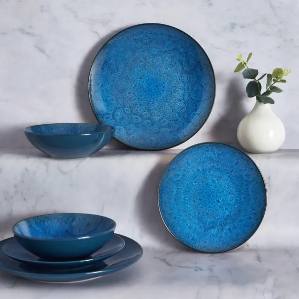 Blue and teal patterned dinnerware set.
