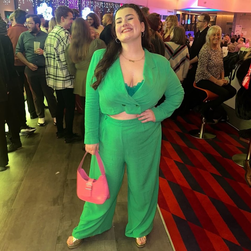 Charlotte Jaconelli in a green suit at an event.