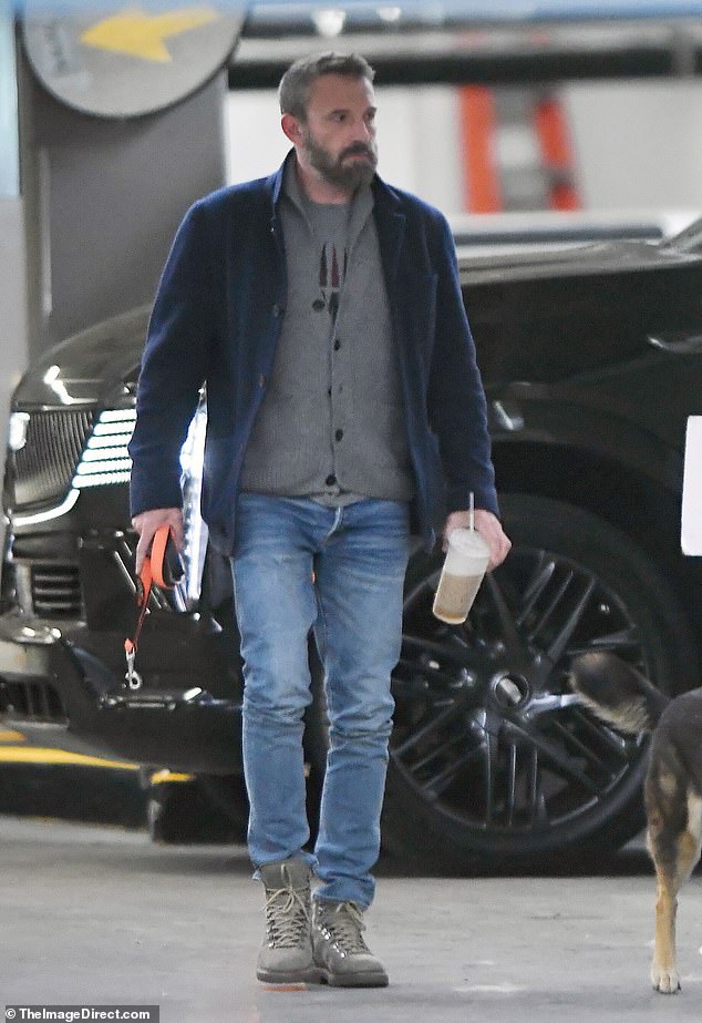 To keep warm in the chilly morning air, the Deep Water star wore a similar gray sweater over a T-shirt with a black jacket, and faded jeans, which he tucked into his beige ankle boots