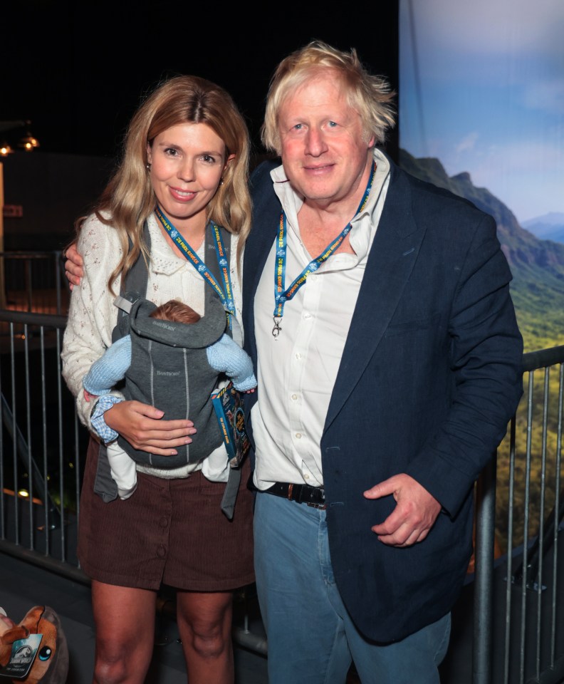 Boris Johnson and Carrie Johnson with their baby at the grand opening of Jurassic World: The Experience in London.